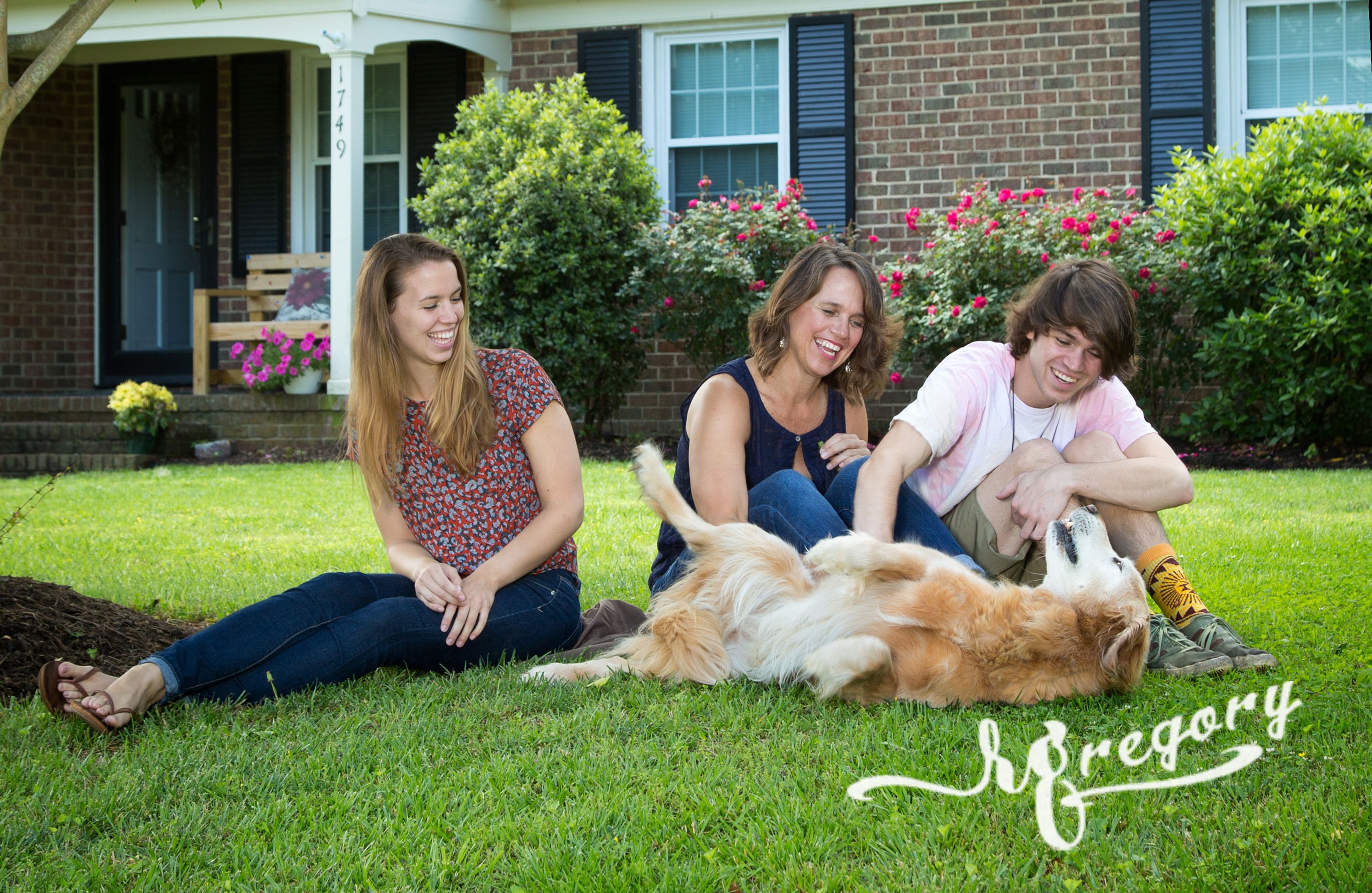 Parcells candid family shot on front lawn with pet dog