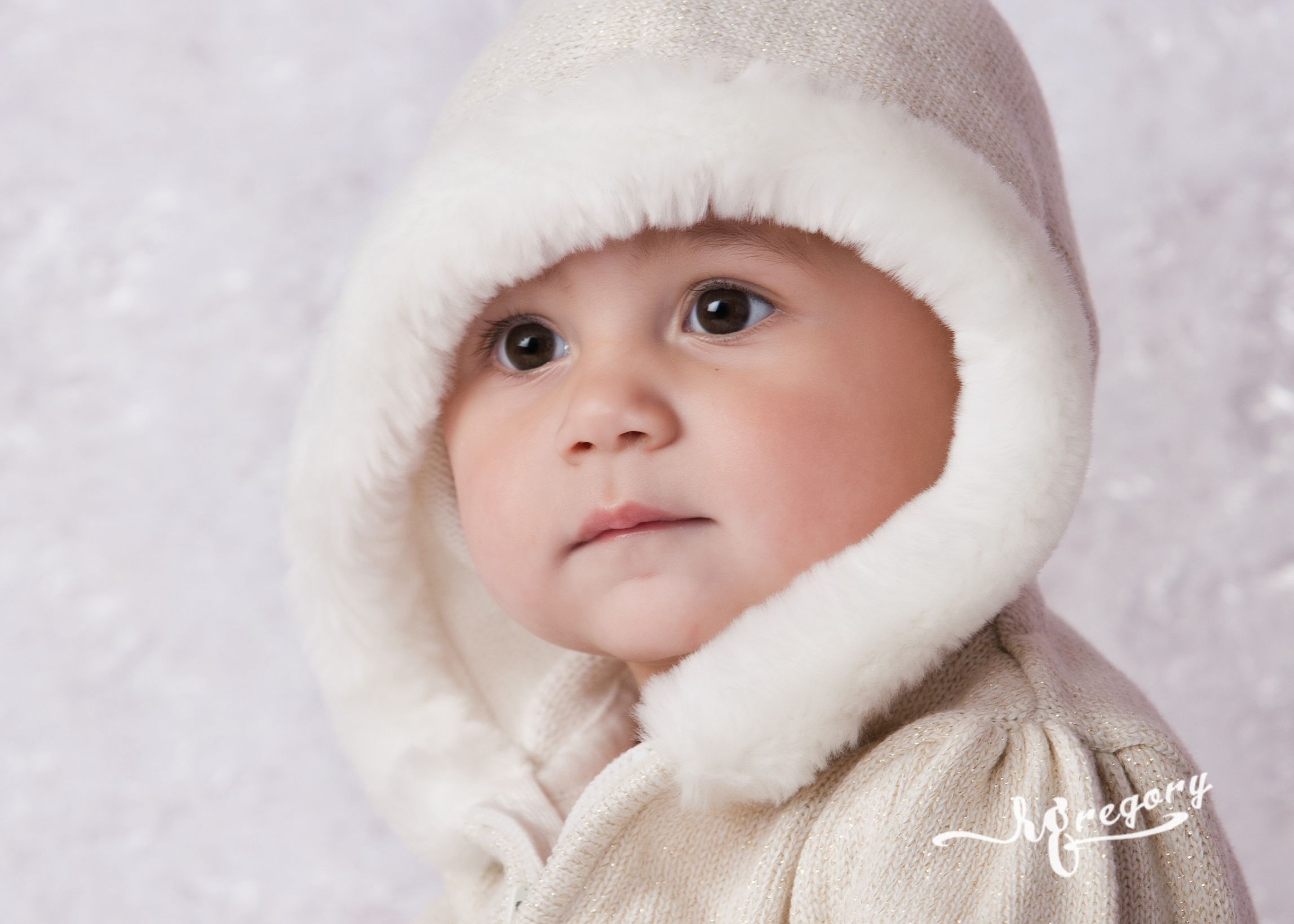 sweet baby face child photo in white fleeced hood